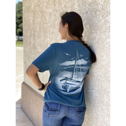 Short sleeve v-neck t-shirt with chillwater beach bound design on the back. Design is a white sailboat resting on a beach with ocean scene in background.
