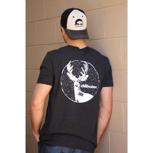Man wearing grey chillwater t-shirt with buck design. Design features buck with snow in the background.