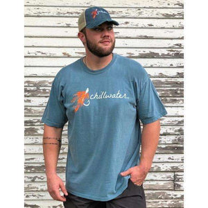 Man wearing blue chillwater tshirt with hook and fly design. Design features an orange fly fishing hook.