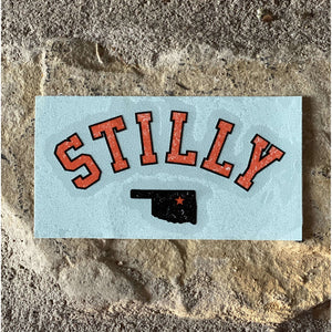 Chillwater Apparel's Stilly design as a transfer sticker with the words in orange and the state of Oklahoma in Black