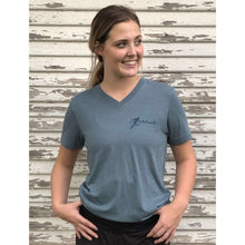 Young woman wearing v-neck chillwater tshirt with angler design. Front design features a fly fishing hook on the left chest.