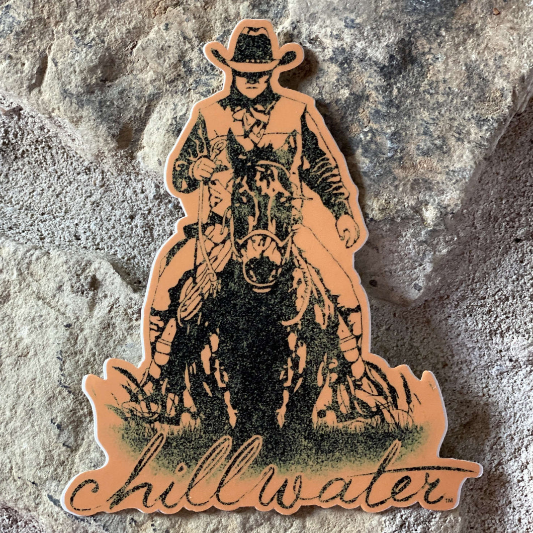 Rawhide “Cowboy” Sticker in orange and black by Chillwater apparel.