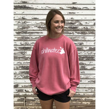 Young female wearing a pink sweatshirt with the Kayak design by Chillwater.