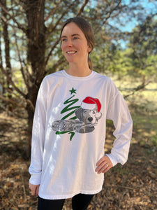 The 2022 Christmas Shirt by Chillwater Apparel in a long sleeve. White long sleeve tee with a dog and a oar.