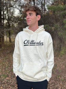 Young male wearing a washed cream hoodie in the Vintage Chill design by Chillwater. The front shows the words “chillwater” in beautiful flowing font.