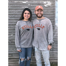 Faded grey Thermal Long Sleeve tee by Chillwater Apparel with the Stilly design on the front. The front pictures the words ‘Stilly” in orange and the state of Oklahoma in black with a star of Stillwater.