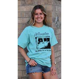 Turquoise comfort color tshirt with chillwater's jim tom design on the front center. Design includes chillwater lettering, photo of jim tom dog in a jeep and the words "fine apparel for the truly chilled".