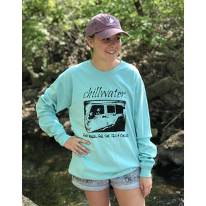 Turquoise long sleeve comfort color tshirt with chillwater's jim tom design on the front center. Design includes chillwater lettering, photo of jim tom dog in a jeep and the words "fine apparel for the truly chilled".