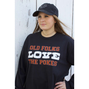 Black comfort stretch long sleeve tshirt with Old Folk Love the Pokes written in orange and white lettering on the front center.