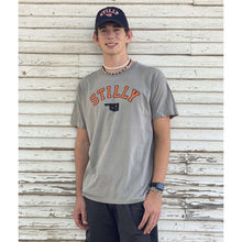Grey comfort stretch short sleeve t-shirt with orange stilly logo and small black oklahoma with orange star on stillwater location.
